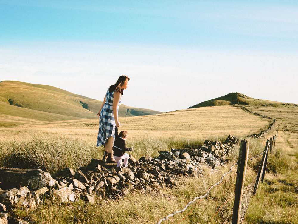 Exploring the edge of a sheep filled field in the Cumbrian Lake District with our traveling baby.