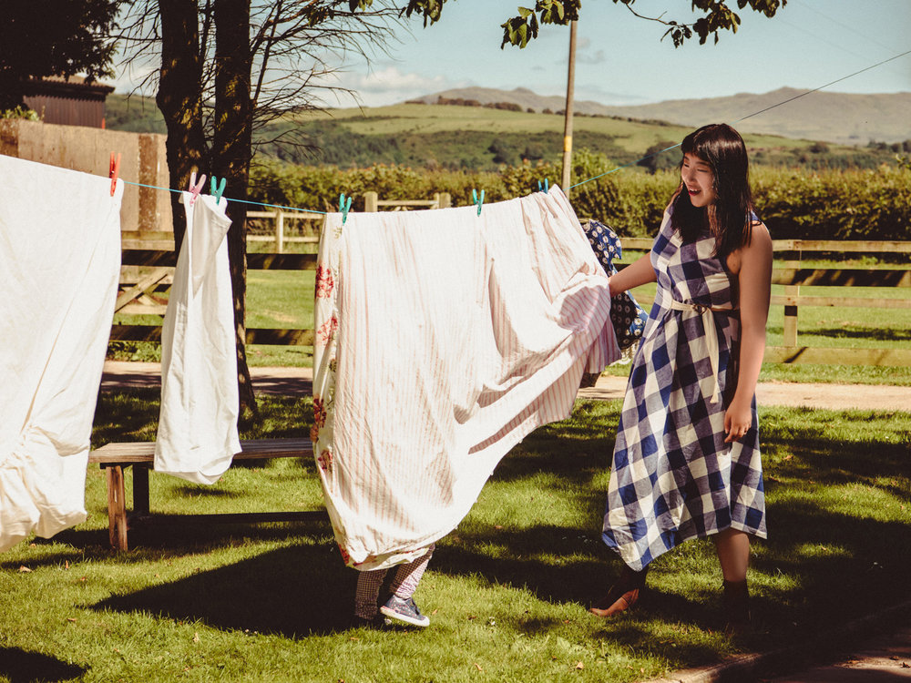 Lisa helps with the laundry.