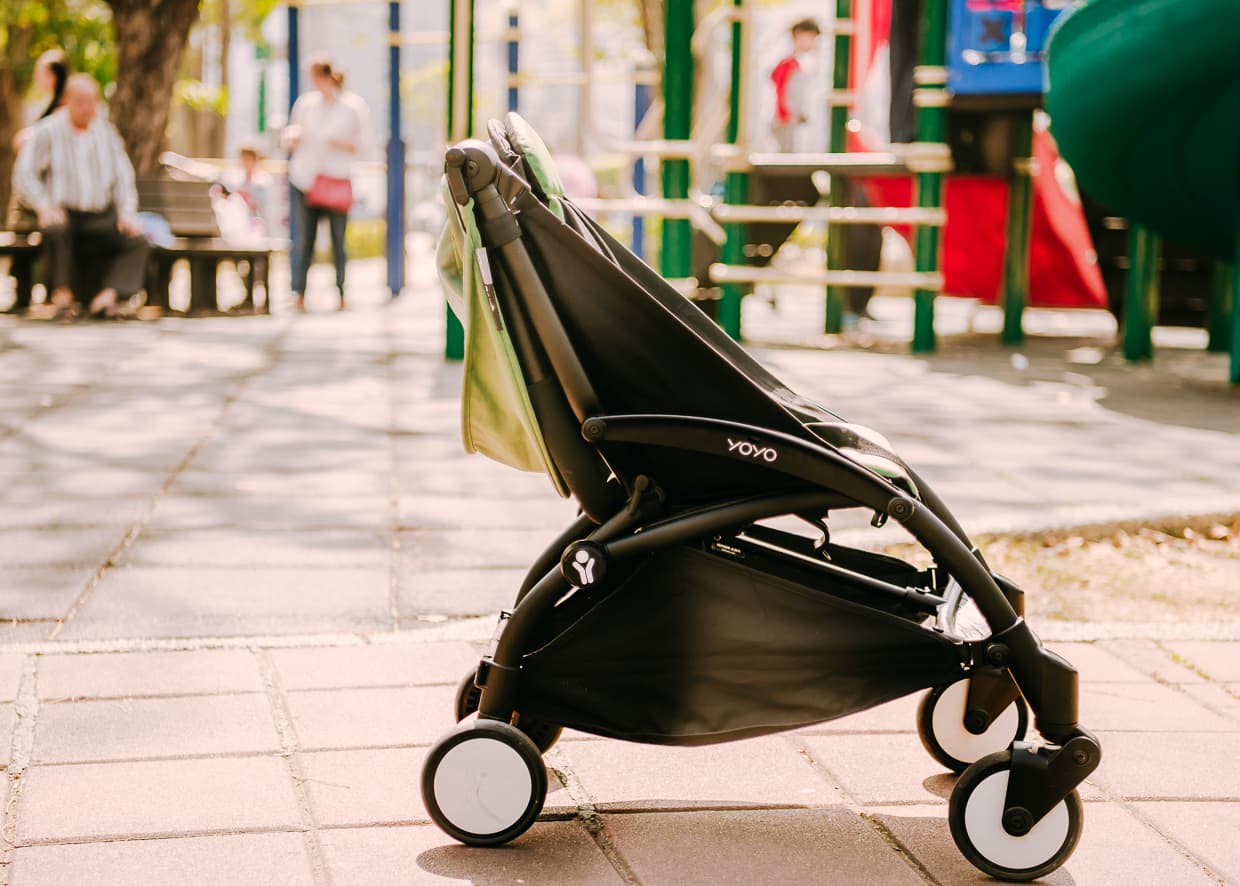 The Babyzen Yoyo Travel Stroller Halfway folded.