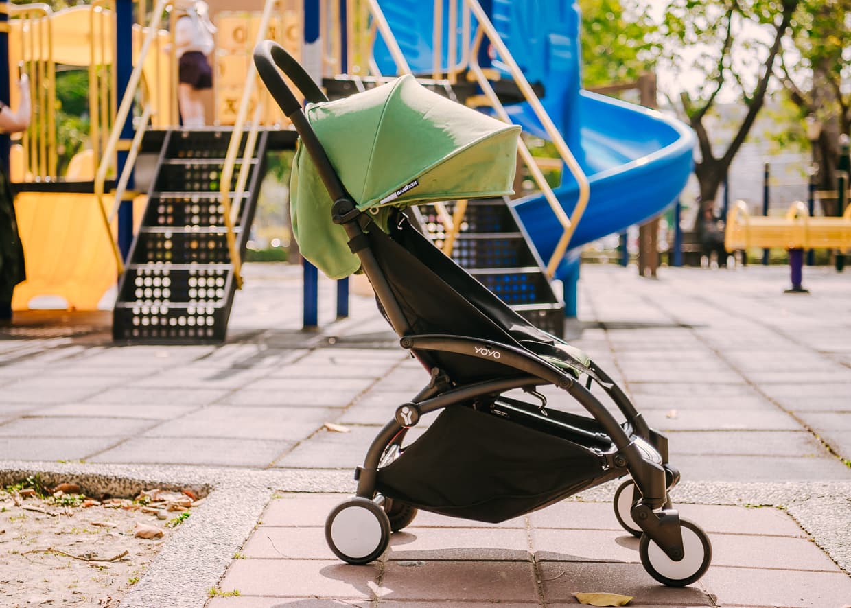 The Babyzen Yoyo Travel Stroller fully opened in a playground.