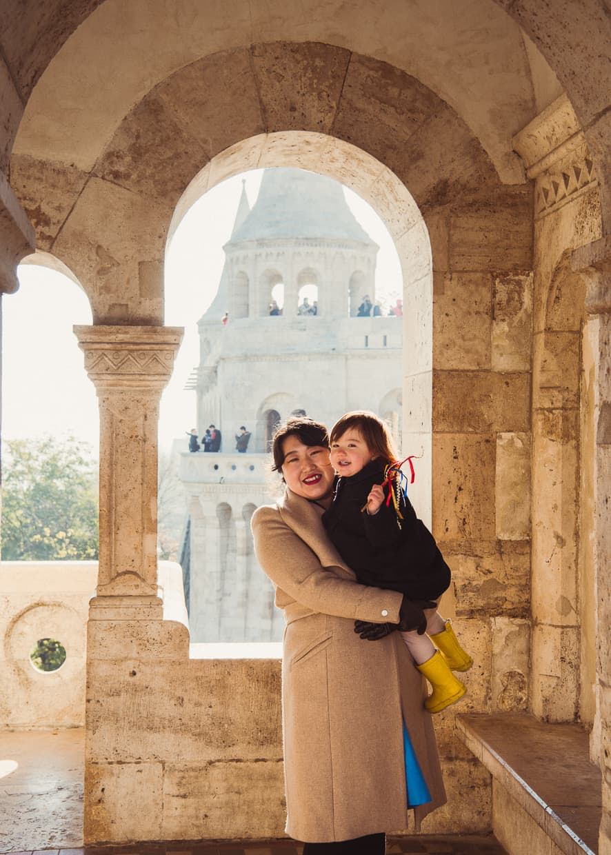 Posing in front of an archway at the Fisherman's Bastion in Budapest, Hungary.