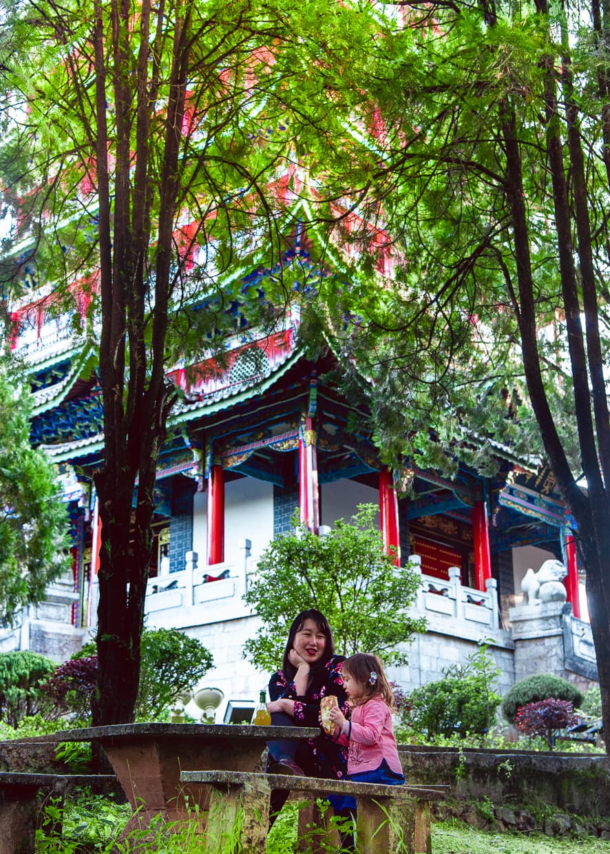 Picnic on Lijiang's Lion Hill with Wangu Tower in the background.