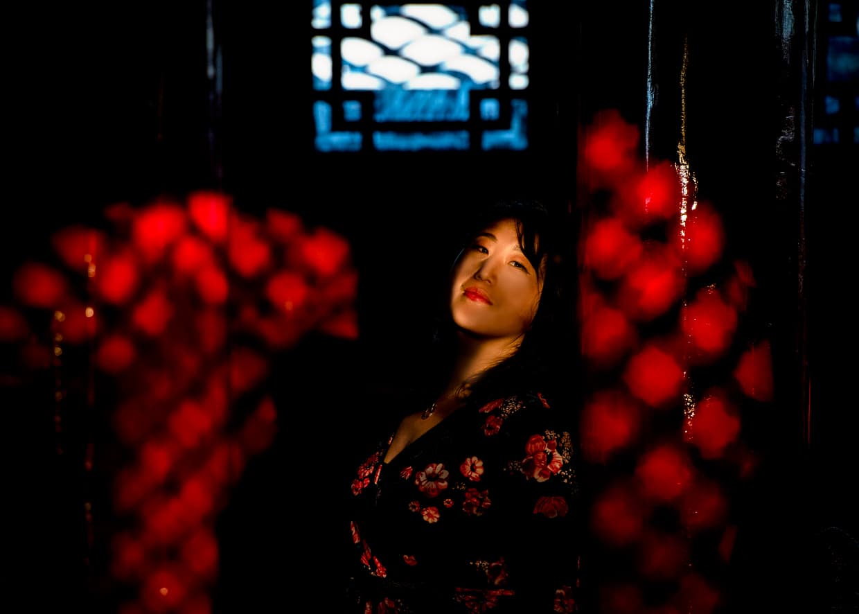 Taking advantage of cool lighting inside Wangu Tower on Lijiang's Lion Hill.