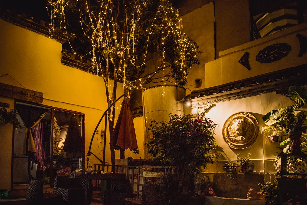 A Lijiang, China hotel courtyard at night.