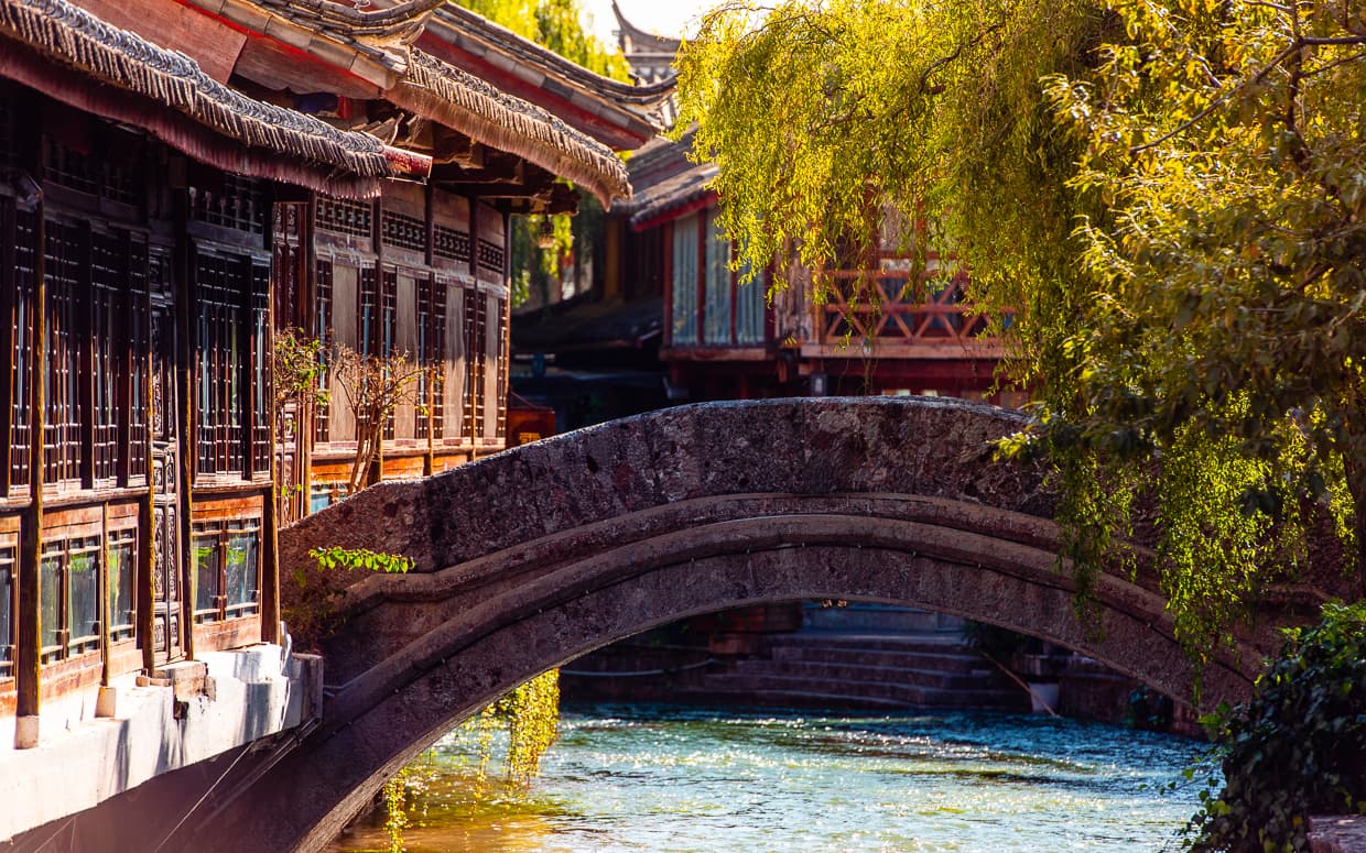 A bridge over a Lijiang Old Town river.