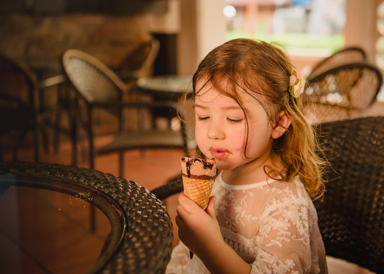 Toddler eating ice cream in Bangkok, Thailand.