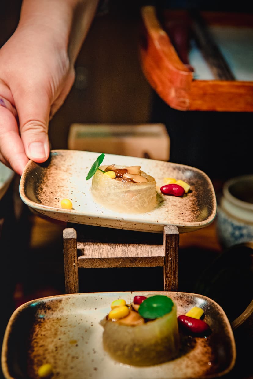 Selecting a plate of vegetarian food from a Dali, China buffet