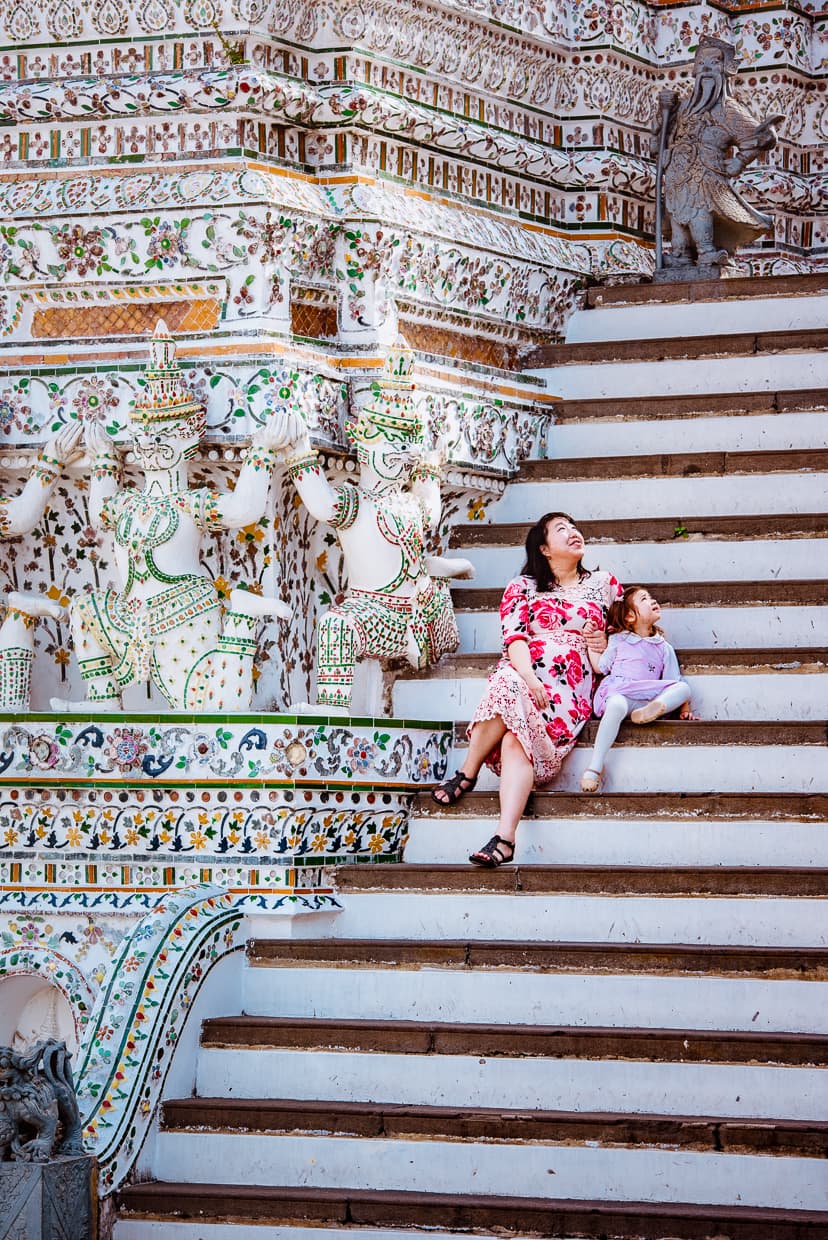 Sitting on the steps of Wat Arun in Bangkok, Thailand.