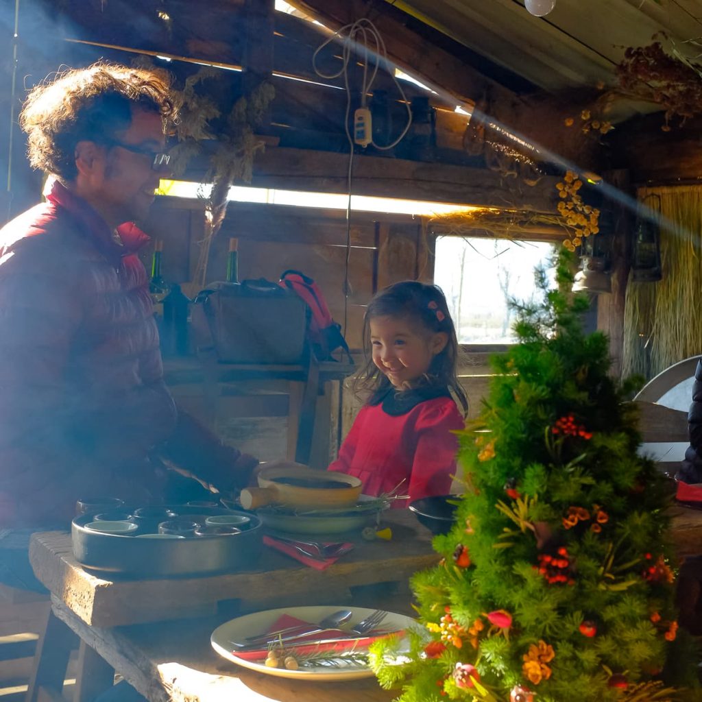 Lisa and Jake by the Christmas tree at Li Li's farm in Dali, China.