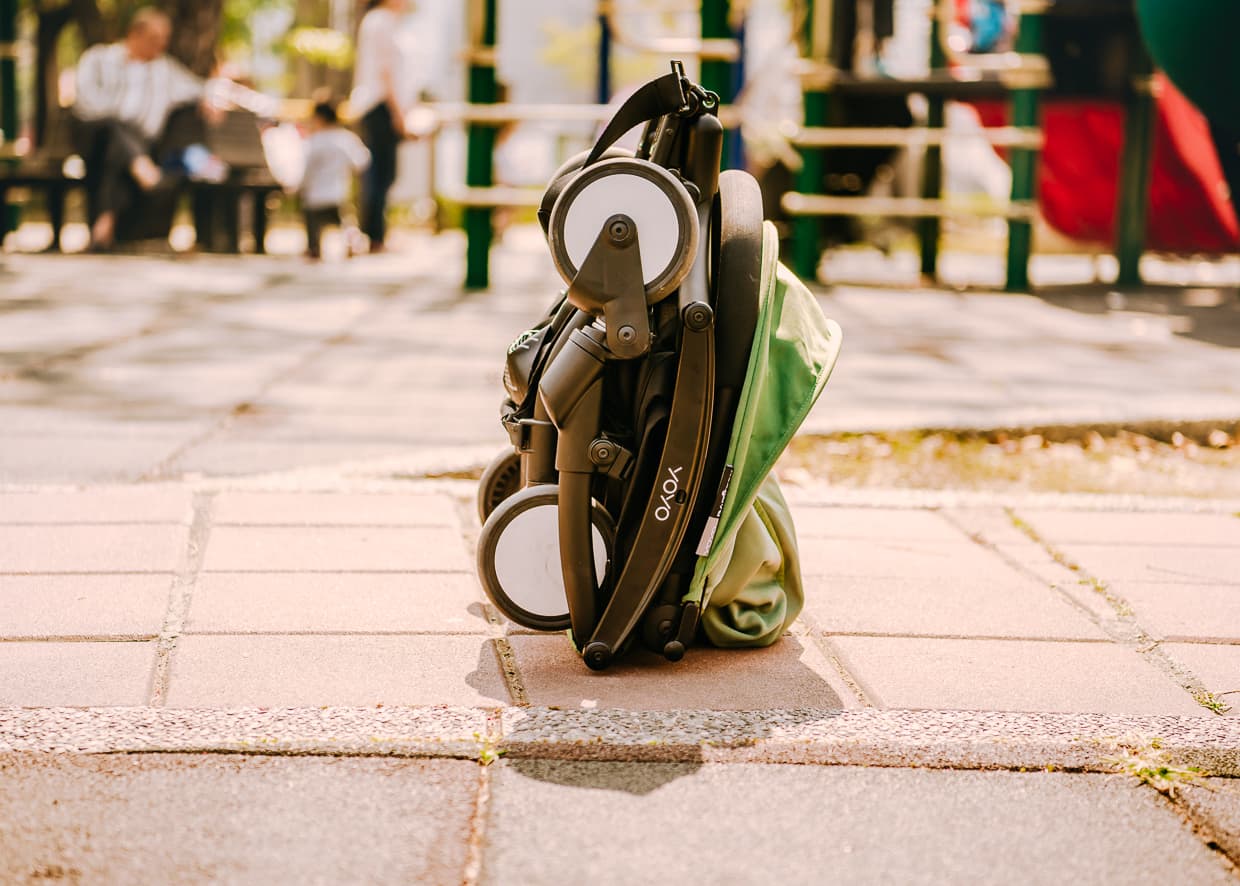 The Babyzen Yoyo Travel Stroller standing upright while folded.