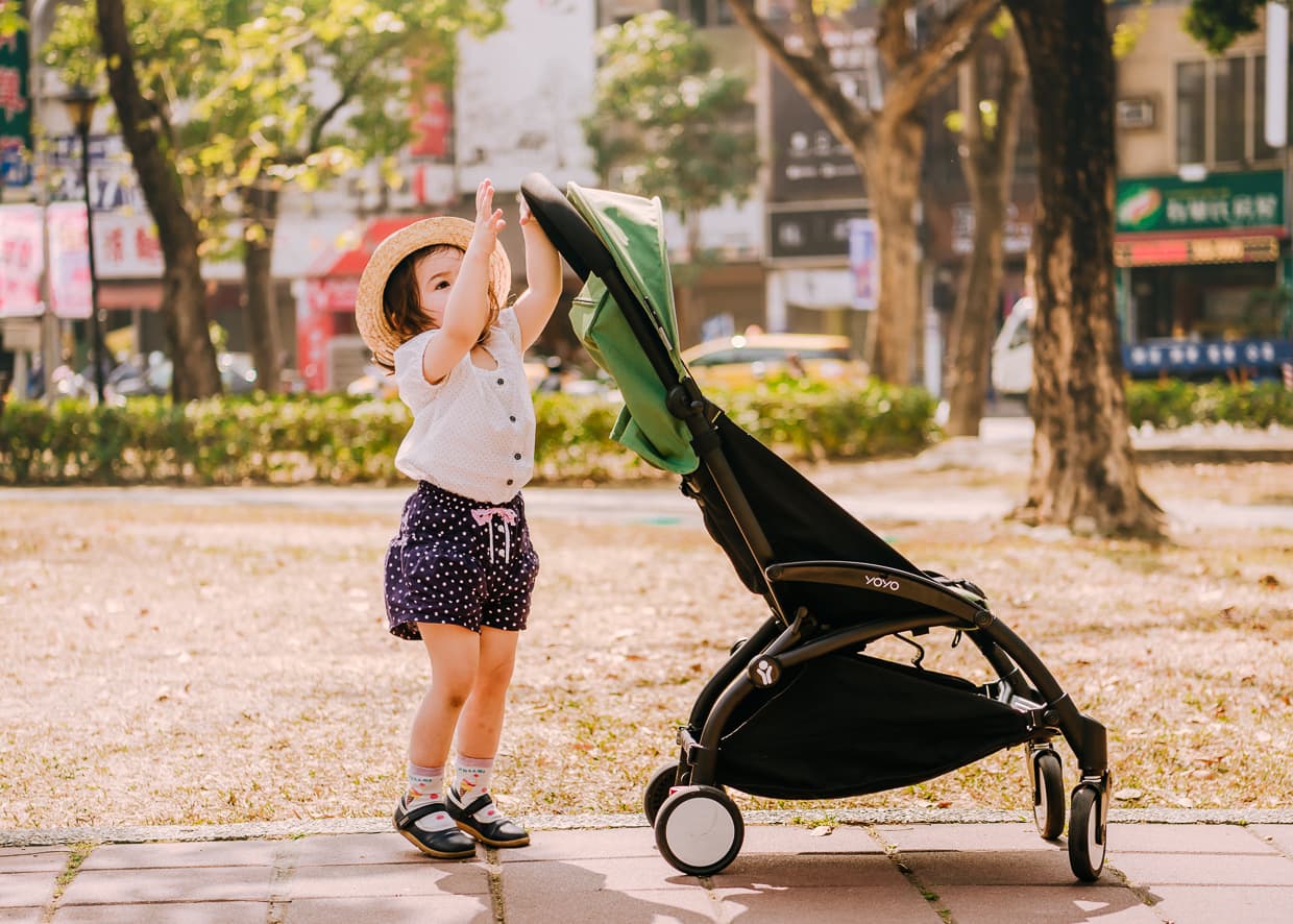 Lisa playing with the yoyo travel stroller