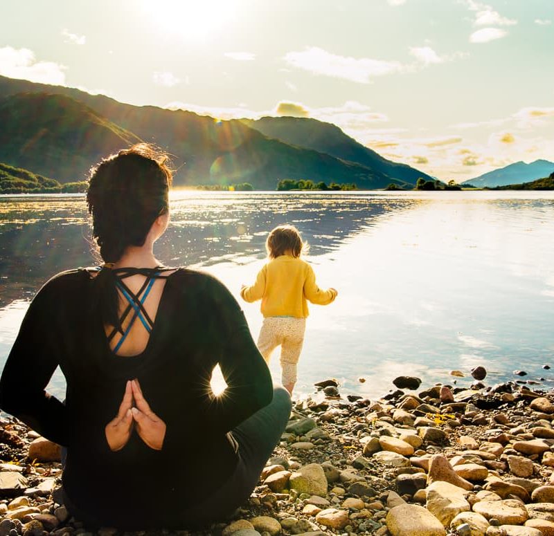 Yoga while camping in Glencoe, Scotland on Loch Leven.