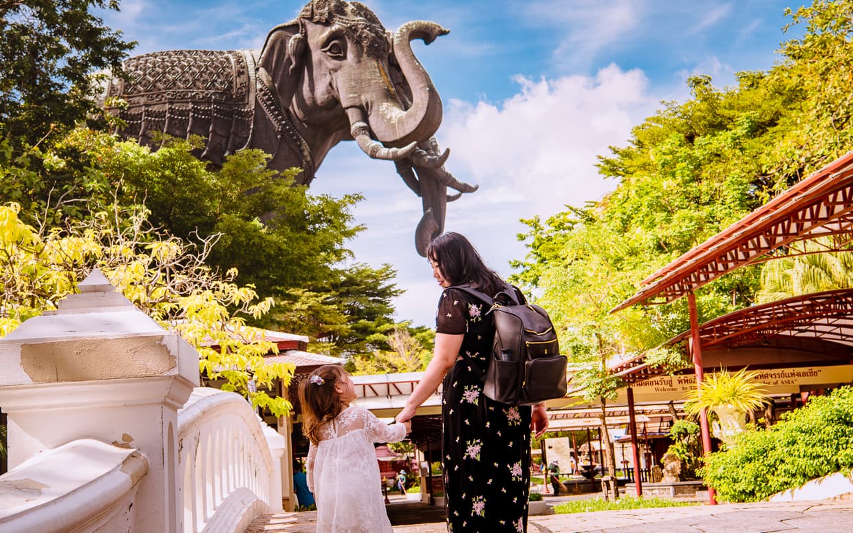 Walking across the bridge into the Erawan Museum. Idaho Jones diaper bag.