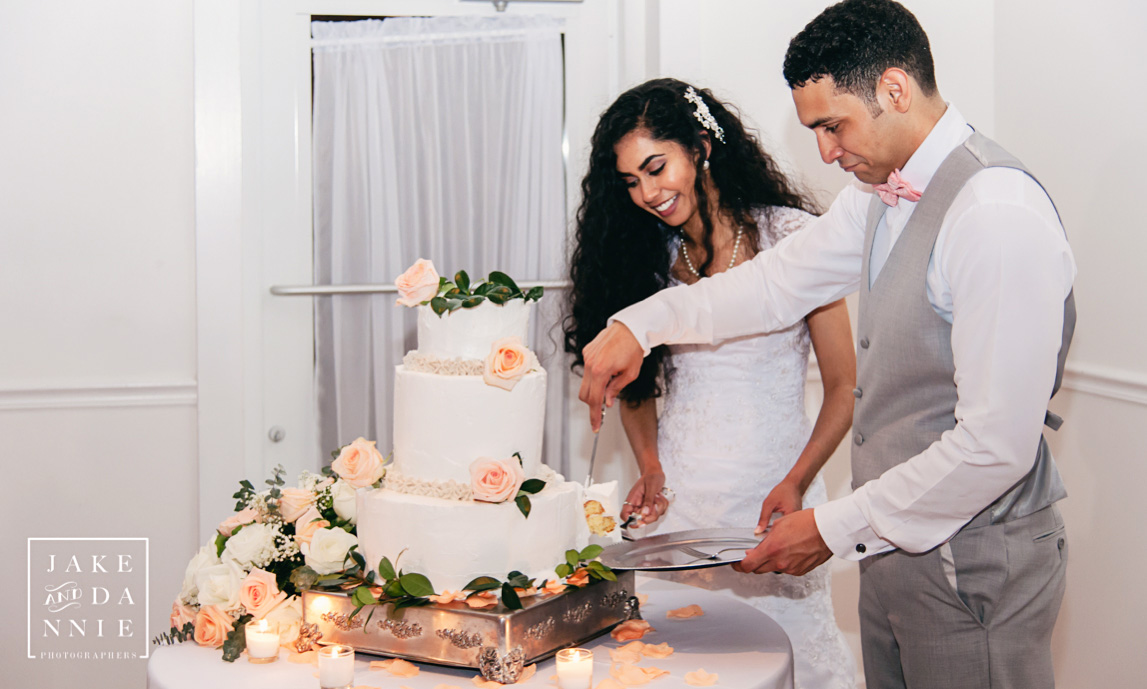 Cutting the wedding cake together.