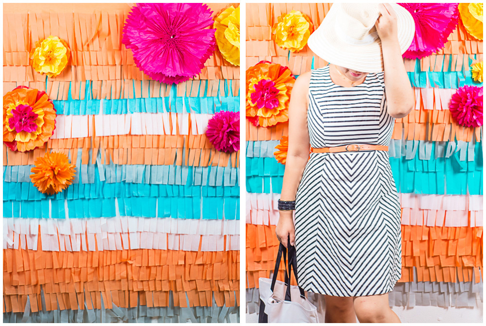 Dannie tests out the tissue paper photo booth backdrop we made as a diy project