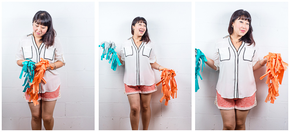 Dannie gets ready to tape up diy photo booth backdrop