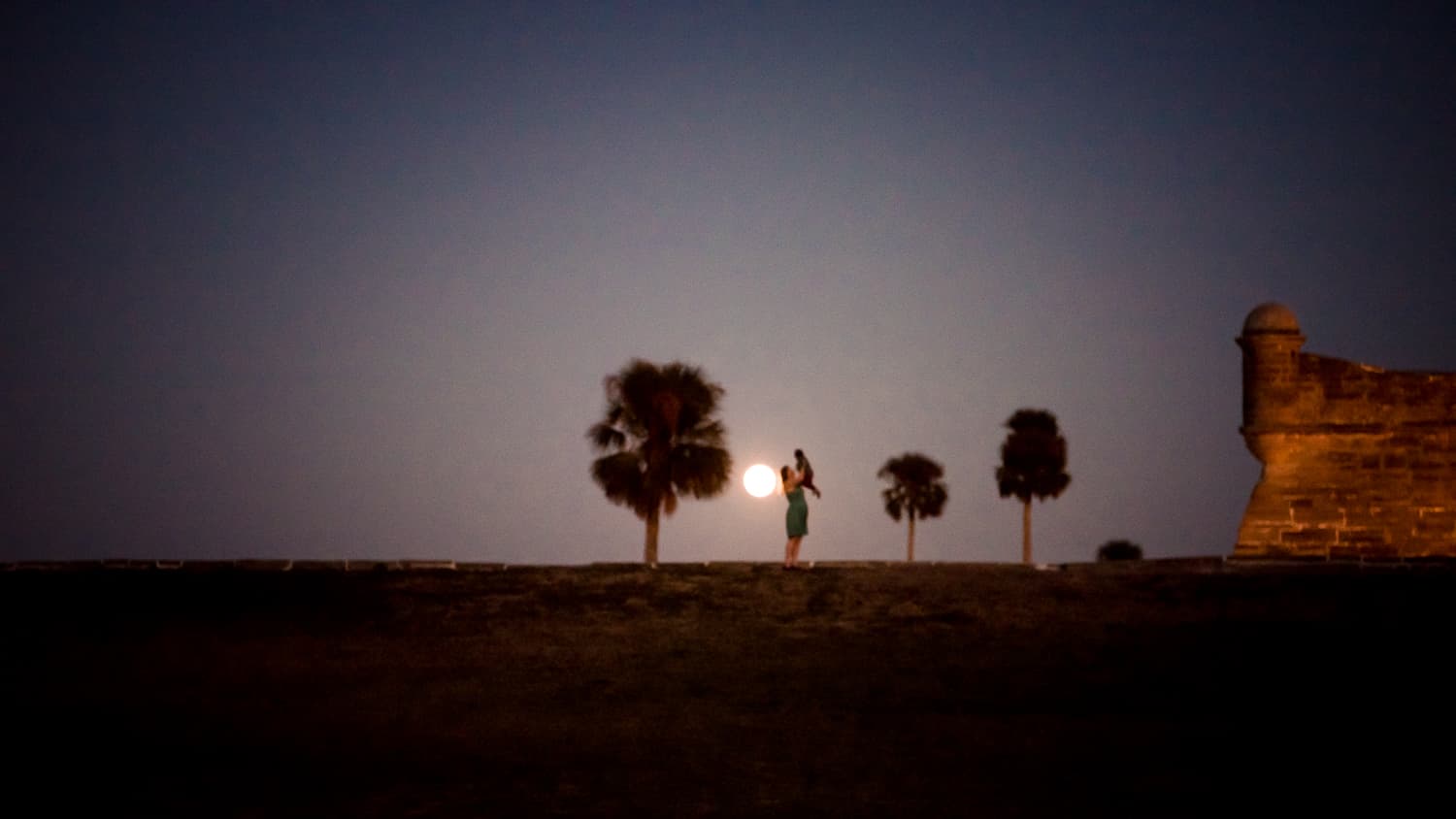 Playing in front of a full moon in St. Augustine, Florida on our Christmas road trip.