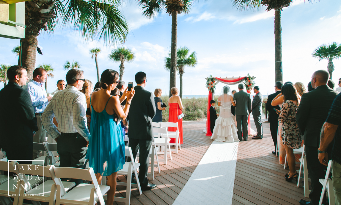 Florida bride and groom stand in front of their friends and family on teir wedding day.