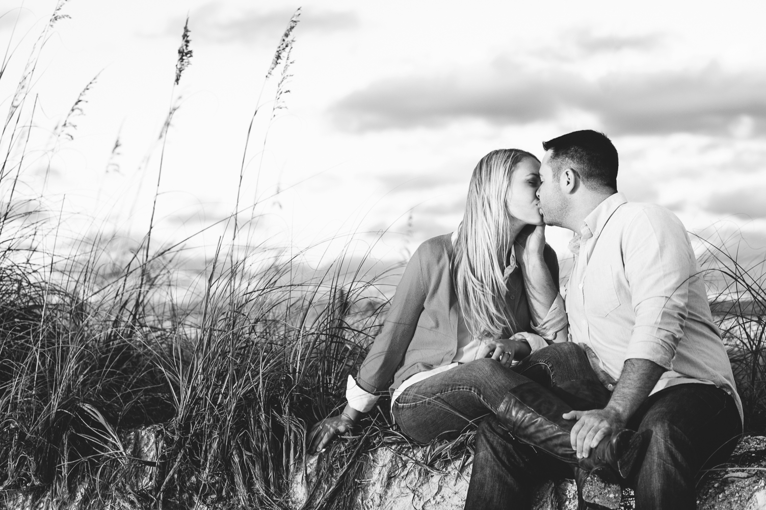 Black and White of a couple kissing in the dunes
