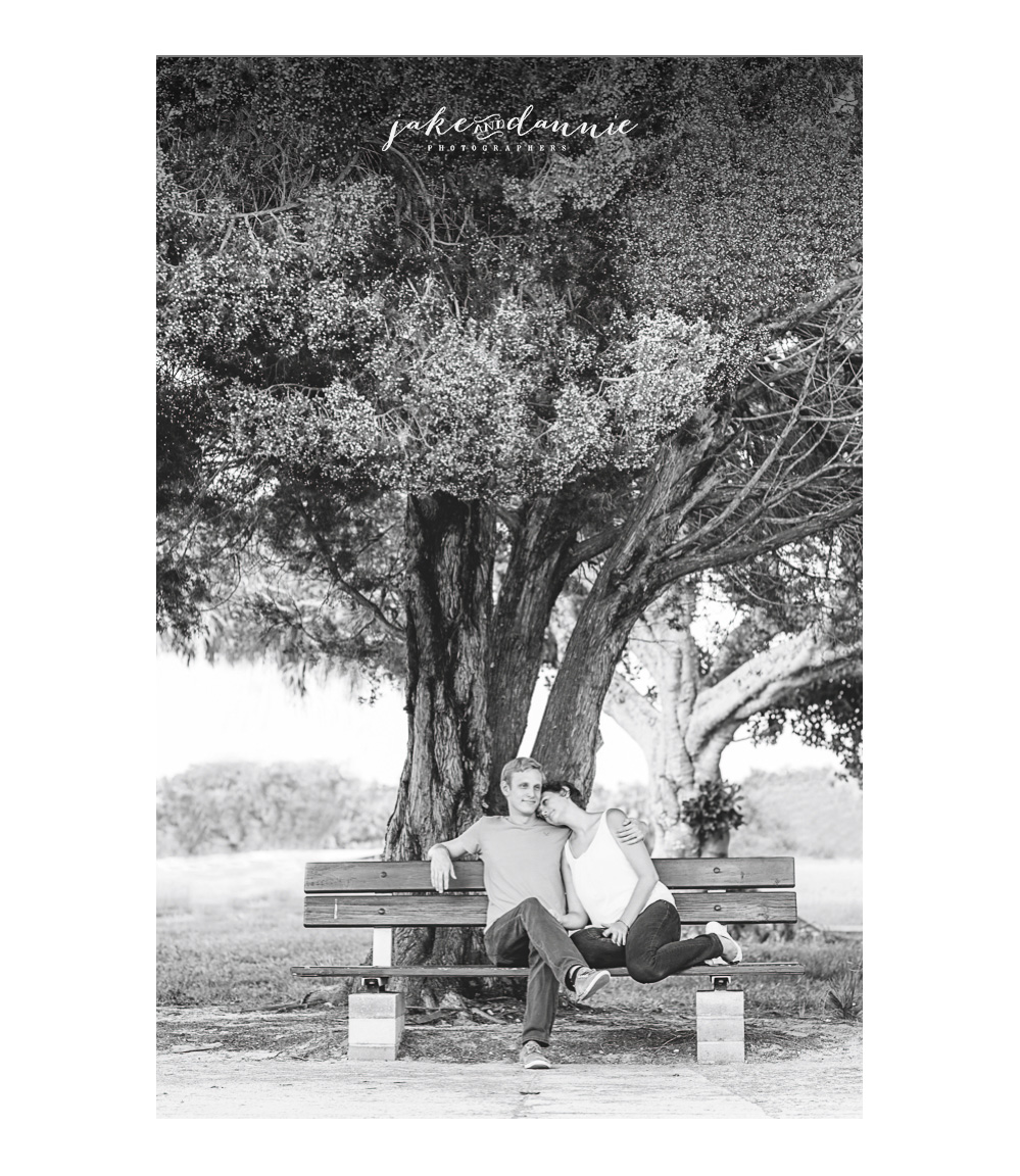 A black and white photograph of Susie and Trevor resting during their couples session