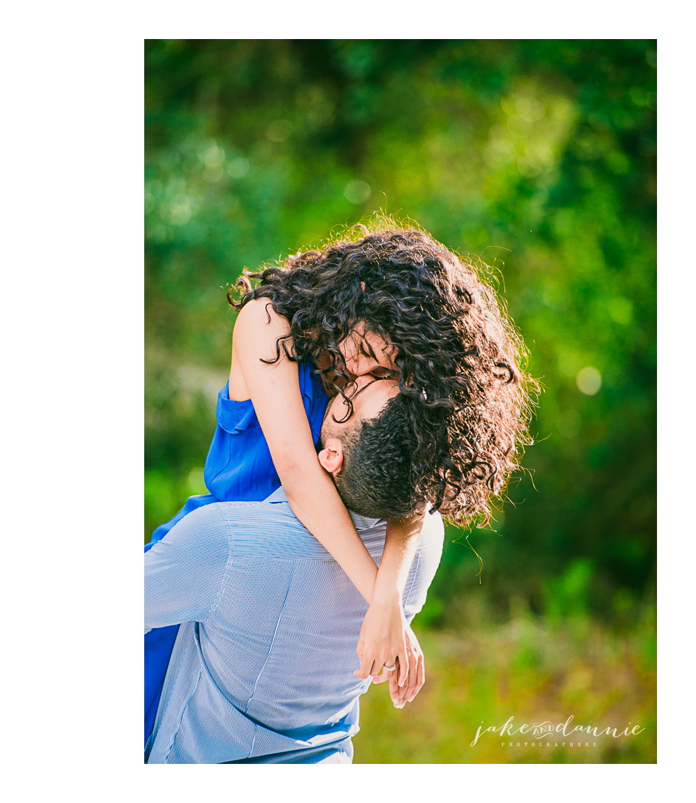 Luigi lifts amy for a kiss for engagement photography