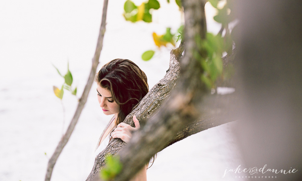 Model stands by tree at fort desoto in florida