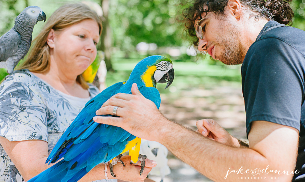 Jake pets a parrot in Forsyth Park