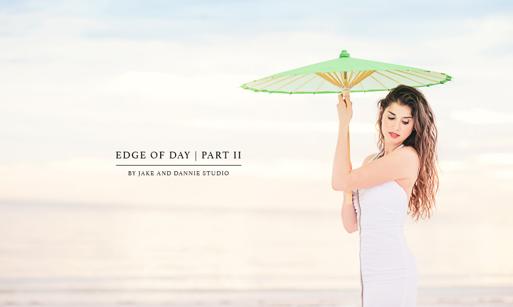 Bride on beach with umbrella