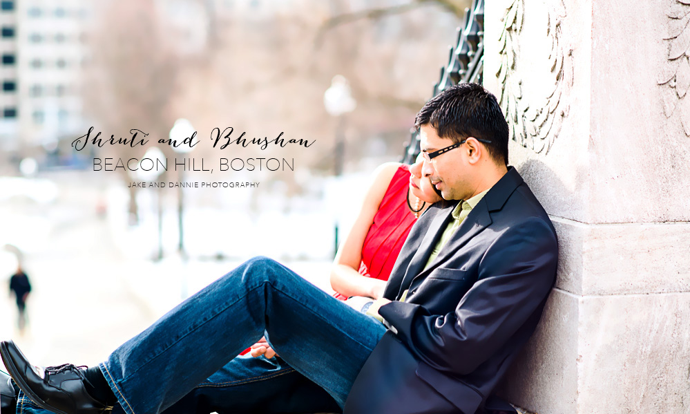 Couple sitting by Boston Common during engagement session