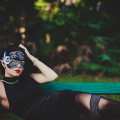 Model sits on swing wearing black mask in Palm Harbor Florida