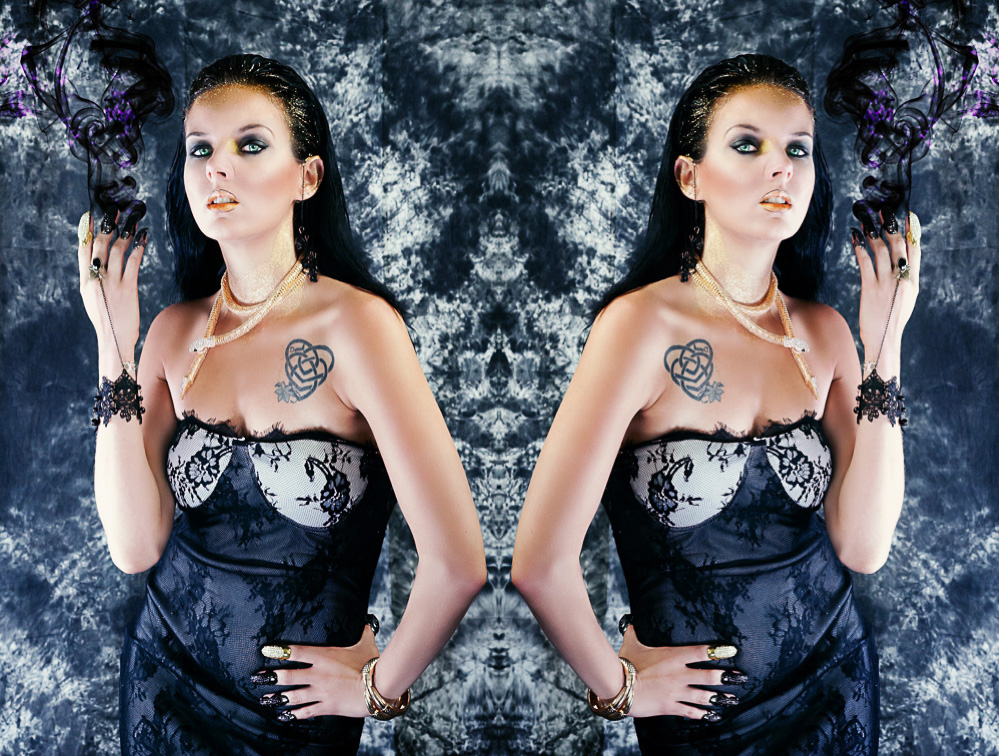 Mirror photo of model as medusa with purple flames in halloween photo