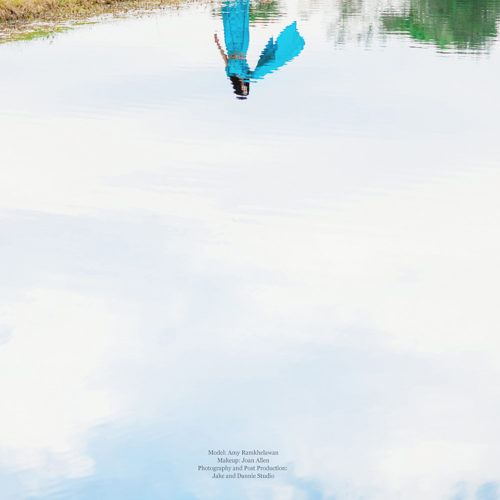 Reflection of woman wearing blue indian clothing